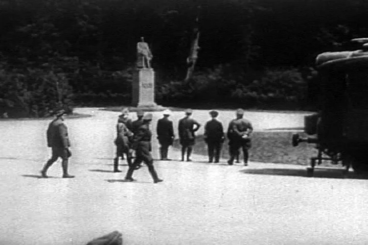 Adolf Hitler (hand on hip) looking at the statue of Ferdinand Foch before starting the negotiations for the armistice at Compiègne, France (21 June 1940)