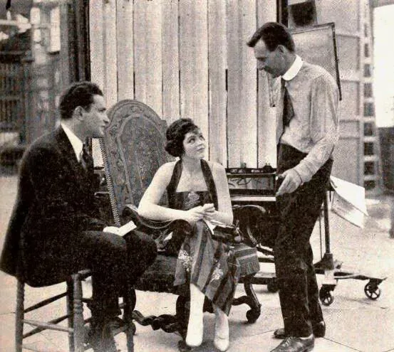 Alan Crosland (standing) telling stories to Myron Selznick and Elaine Hammerstein, 1919