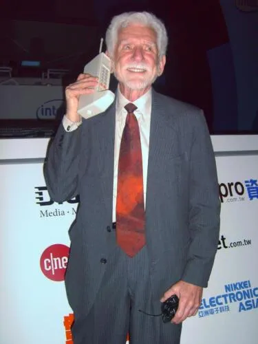 Dr. Martin Cooper, the inventor of the cell phone, with DynaTAC prototype