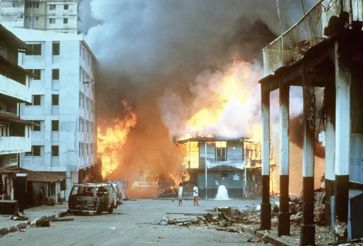 Flames engulf a building following the outbreak of hostilities between the Panamanian Defense Force and U.S. forces during Operation Just Cause