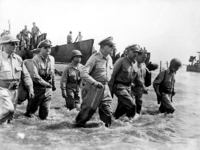 Gen. Douglas MacArthur wades ashore during initial landings at Leyte, Philippine Islands - Battle of Leyte