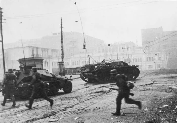 German infantry and armored vehicles battle Soviet defenders on the streets of Kharkov