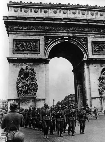 German soldiers marching past the Arc de Triomphe after the surrender of Paris, 14 June 1940