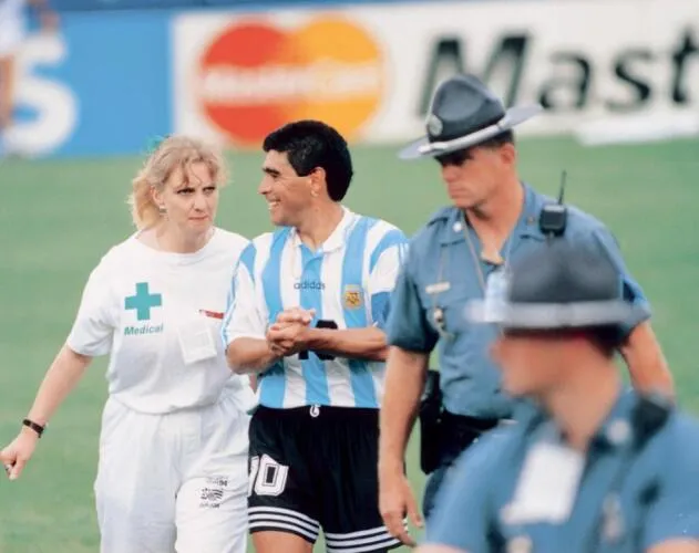 Maradona going to the drug test after playing v Nigeria