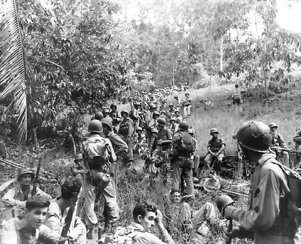 Marines rest in the field on Guadalcanal