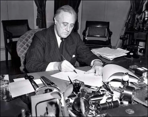 President Roosevelt signs the Lend-Lease bill to give aid to Britain and China (March 1941)