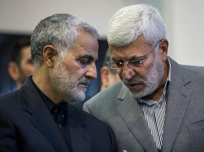 Qasem Soleimani (left) with Abu Mahdi al-Muhandis (right) at a 2017 ceremony commemorating the father of Soleimani, in Musalla, Tehran