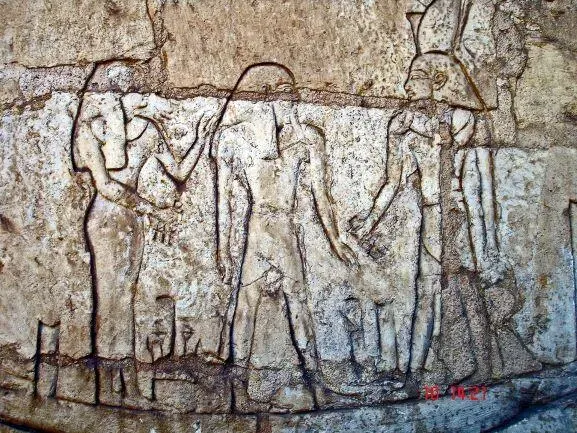 Shoshenq III, standing on the boat "msktt", the boat of the night, with the god Atum. From his tomb in Tanis