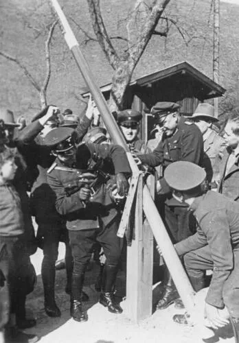 German and Austrian border police dismantle a border post in 1938