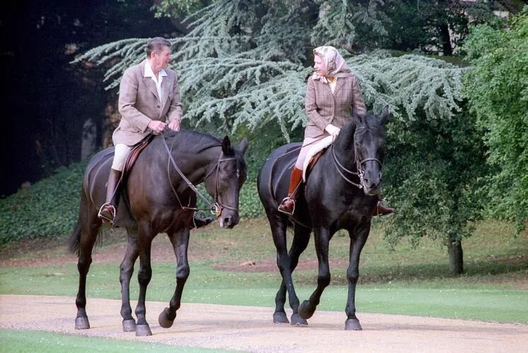 President Ronald Reagan riding horses with Queen Elizabeth II