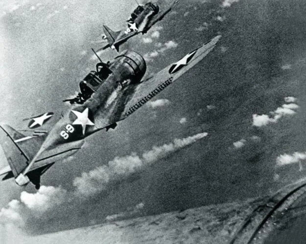 SBD-3 Dauntless bombers of VS-8 over the burning Japanese cruiser Mikuma on 6 June 1942