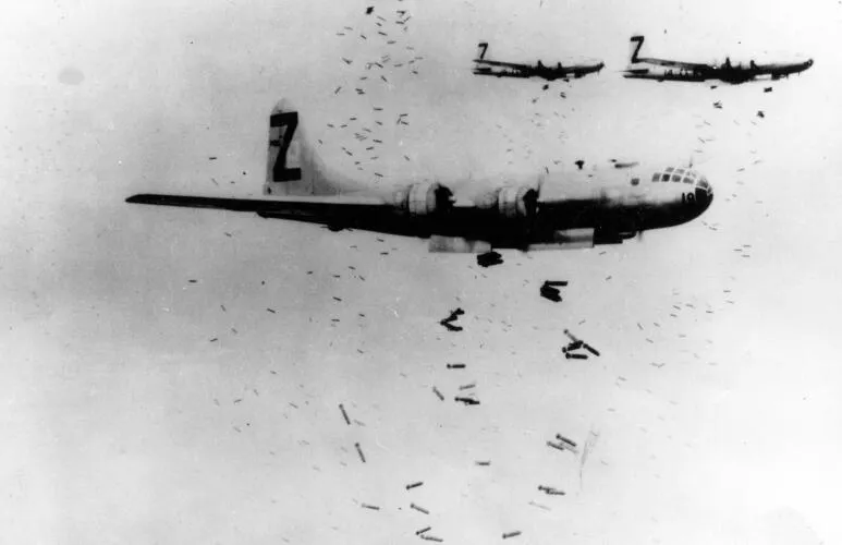 B-29 Superfortress bombers dropping incendiary bombs on Yokohama during May 1945