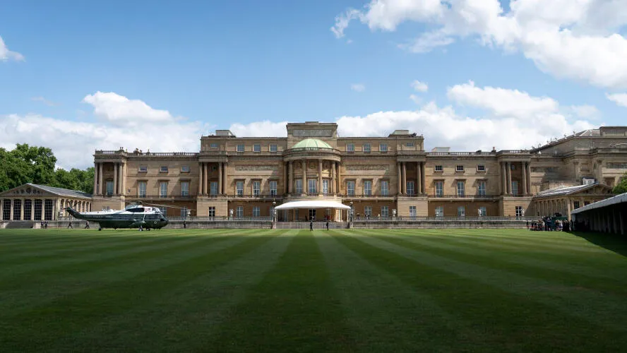 The west façade of Buckingham Palace, faced in Bath stone, seen from the palace garden