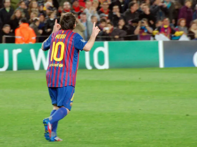 Messi pointing to the sky following his record five-goal display against Bayer Leverkusen
