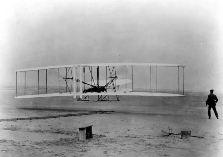 KITTY HAWK, NC -- The first sustained flight with a powered, controlled aircraft. Orville Wright at controls. Distance, 120 feet. Time, 12 seconds Image