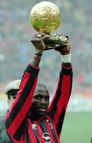 George Weah holdin the Ballon d'Or Trophy - image