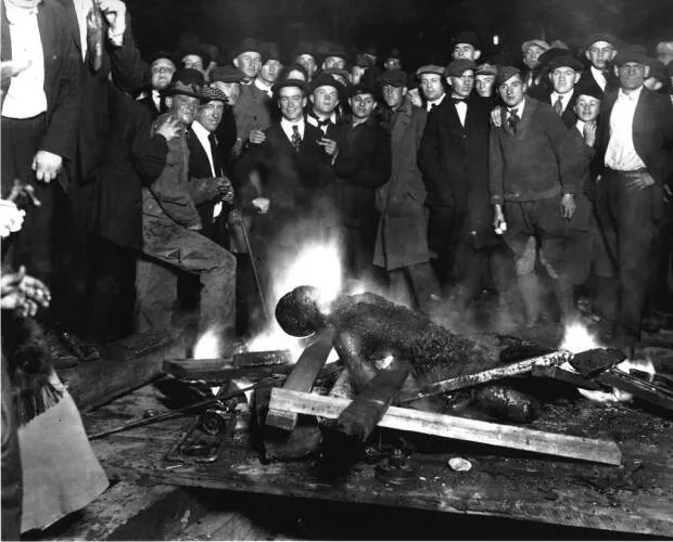 Photograph taken showing the body of Will Brown after being burned by a white lynch mob - Red Summer