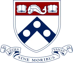 Arms of the University of Pennsylvania with a banner stating the school's motto in Latin