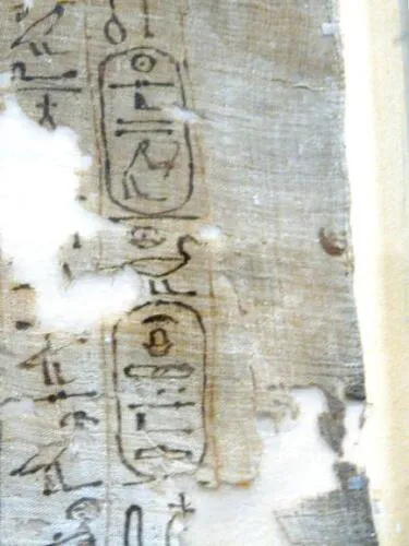 Fragment of the death shroud of Ahmose bearing Seqenenre Tao's titulary