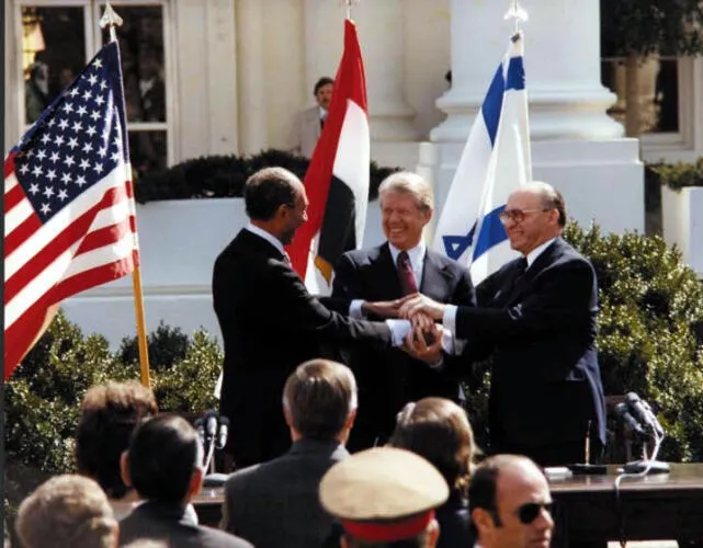 Egyptian President Anwar Sadat and Israeli Prime Minister Menachem Begin and President Jimmy Carter Image