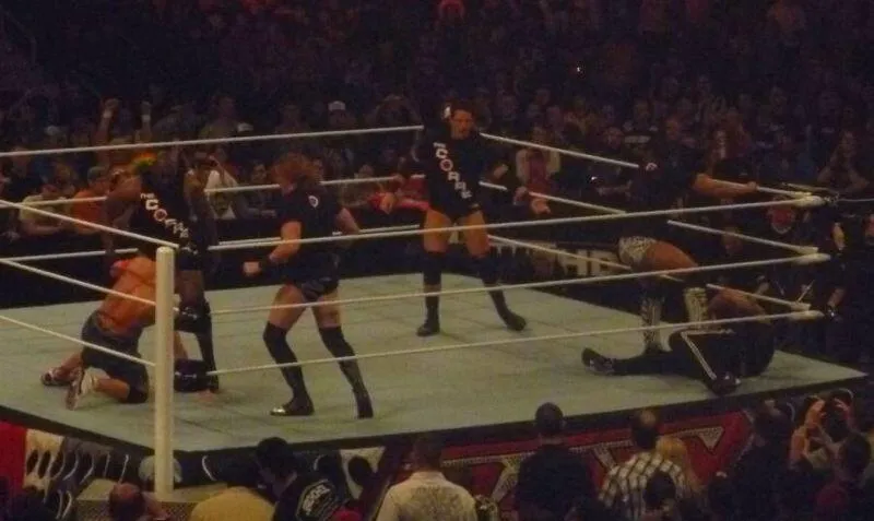 The four members of The Corre attack on John Cena and The Rock