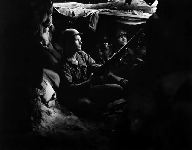 Infantrymen of the 27th Infantry Regiment, near Heartbreak Ridge, take advantage of cover and concealment in tunnel positions, 40 yards from the Communists Image