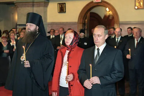 Vladimir Putin and his wife attend a commemoration service for the victims of the terrorist attacks, November 16, 2001.