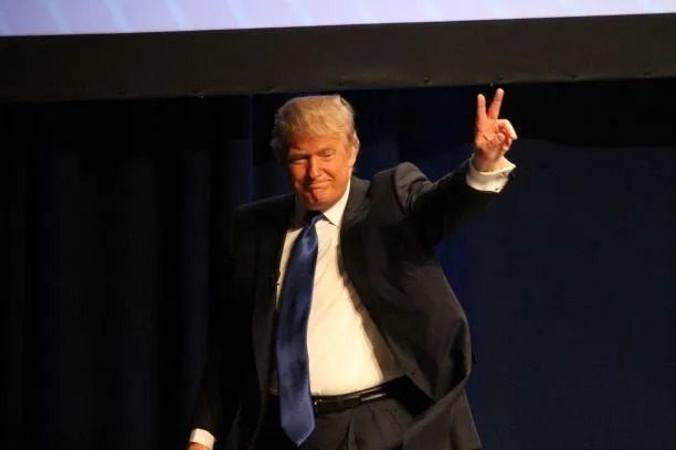 Donald Trump as he exits the stage after speaking at CPAC 2011